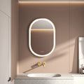 Elston 22" x 32" pill front lit LED mirror with Brushed Gold frame