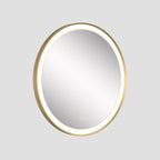 Round mirror with gold frame on a light gray background